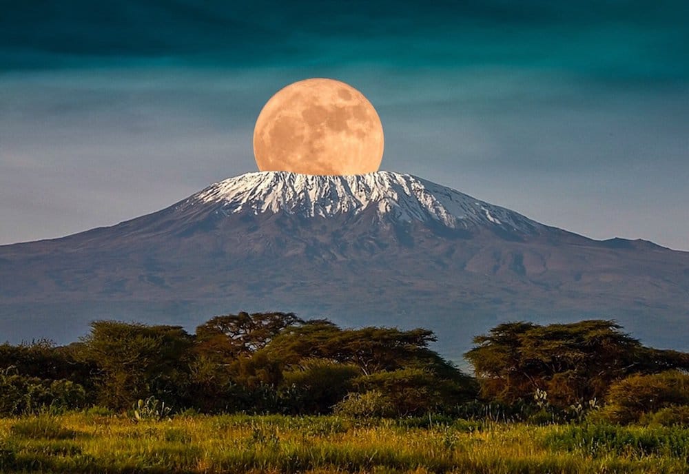 The full moon rises over Mount Kilimanjaro